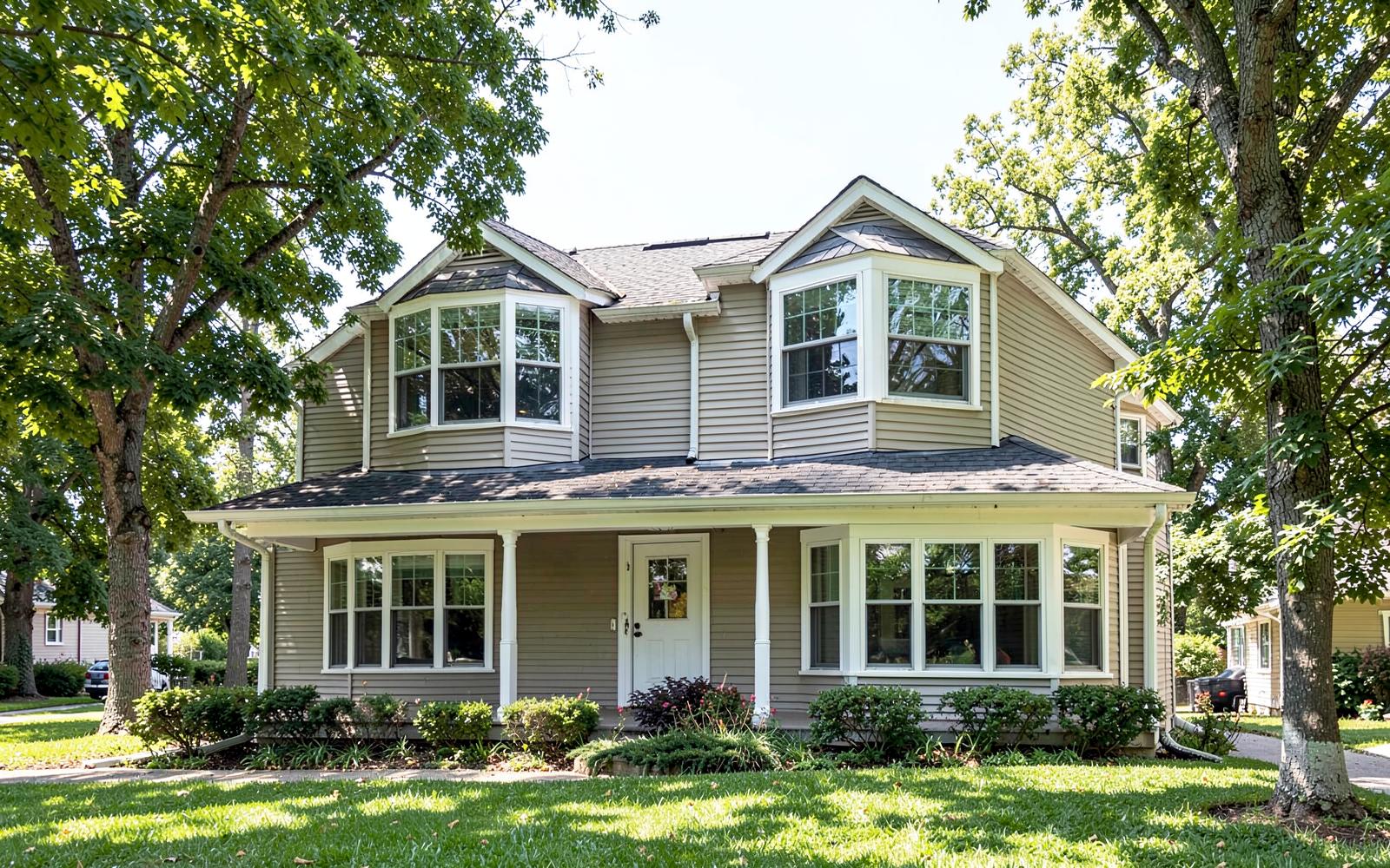 Completed second story addition with dormers and siding matched to the original home