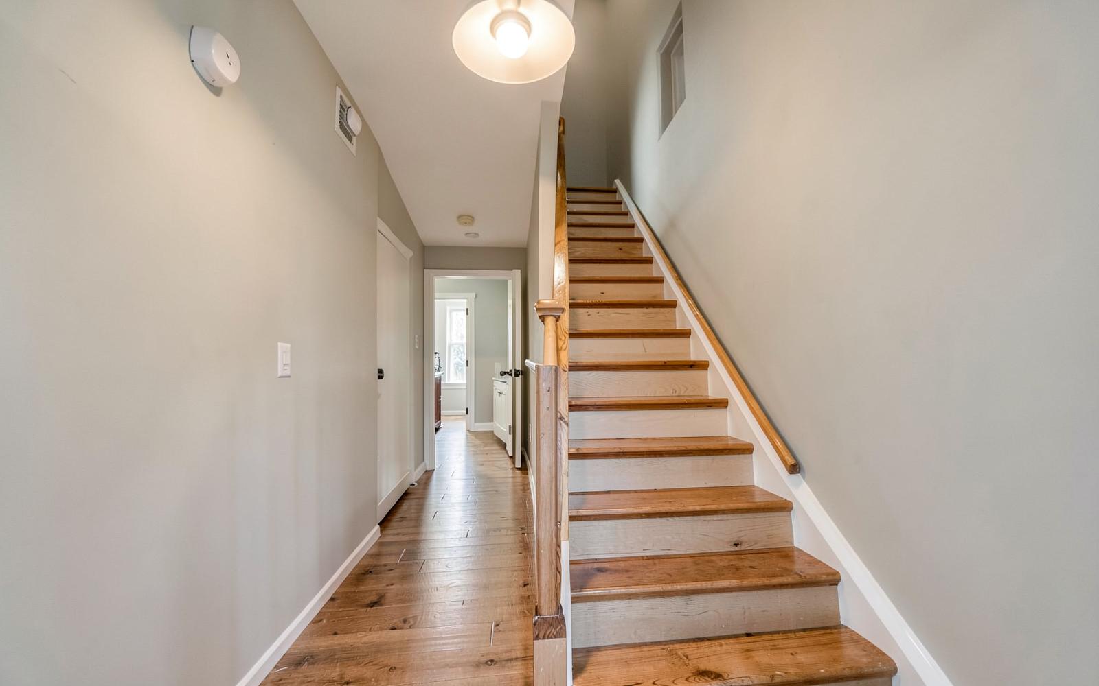 New staircase and upstairs hallway framed and drywalled