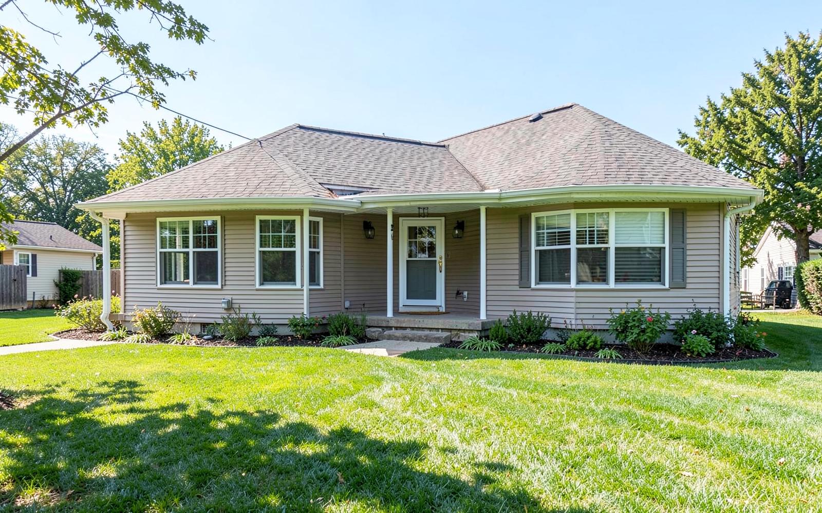 Completed single-story family room home addition with matching siding and roofline