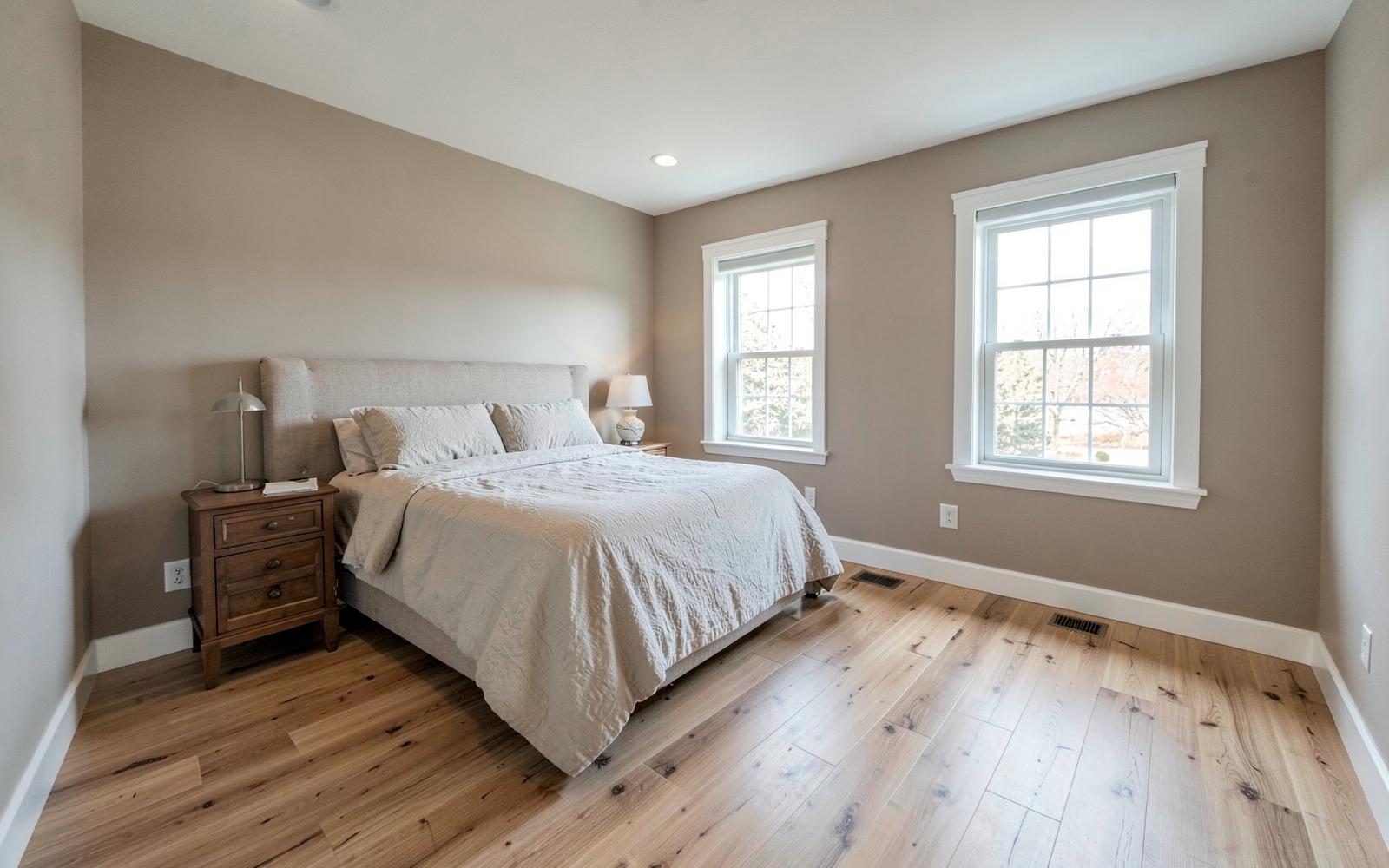 Finished second-floor guest bedroom with wide-plank flooring